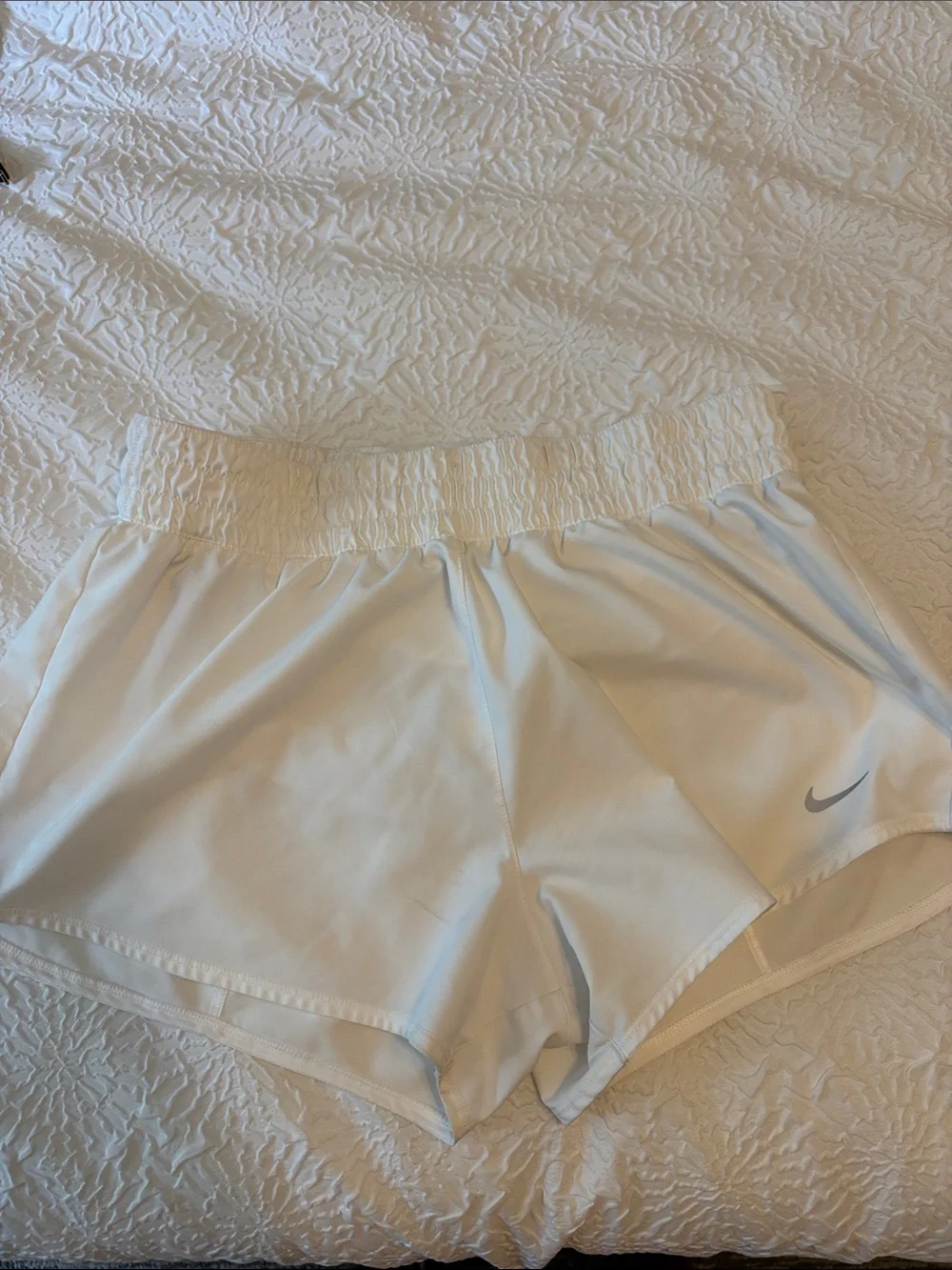 Nike Women's White Athletic Shorts with Silver Swoosh